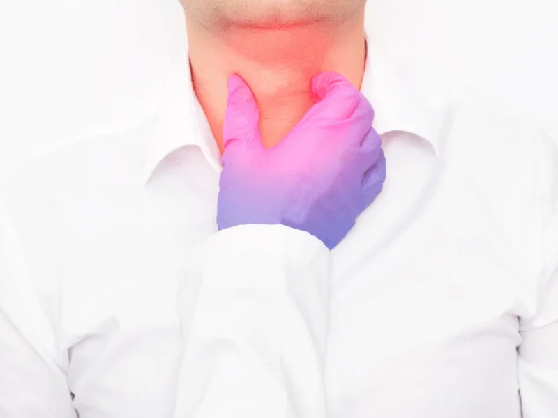 Surgeon examining patient for Head/Neck Cancer
