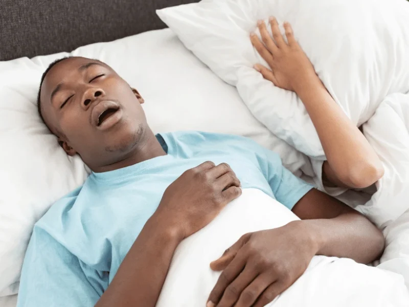 Patient sleeping and snoring experiencing Sleep Apnea