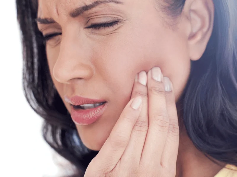 Patient holding painful jaw
